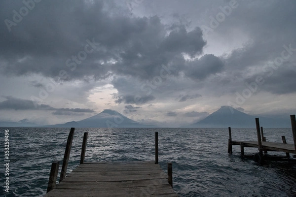 Obraz Cloudy sunset on a pier in lake Atitlan 