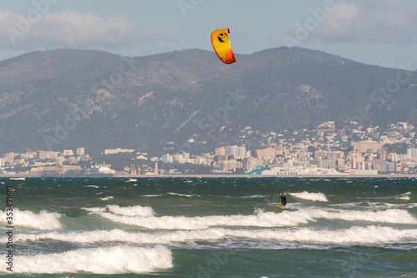 Obraz PALMA DE MALLORCA, SPAIN - MAY 11 2020 : Kite Surfer at the Playa de Palma  at  - Mallorca during Corona Lock down  on May 11, 2020 in Palma de Mallorca, .