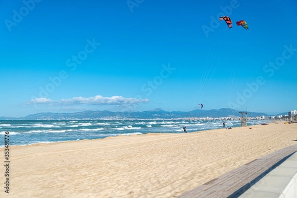 Obraz PALMA DE MALLORCA, SPAIN - MAY 11 2020 : Kite Surfer at the Playa de Palma  at  - Mallorca during Corona Lock down  on May 11, 2020 in Palma de Mallorca, .