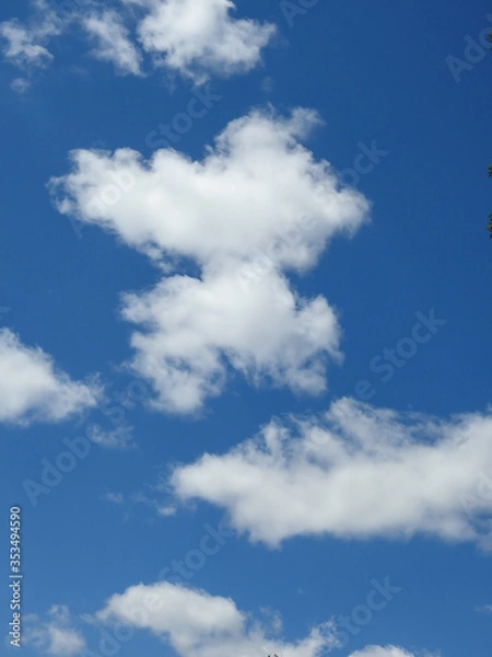 Fototapeta Clouds In The Deep Blue Sky Background