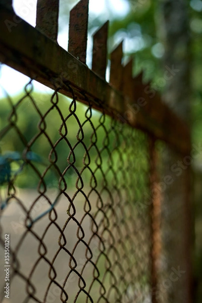 Fototapeta rusty metal fence with blur background