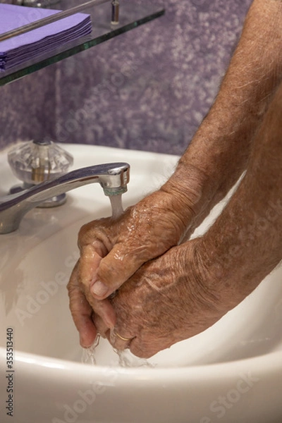 Fototapeta Hands under running water faucet