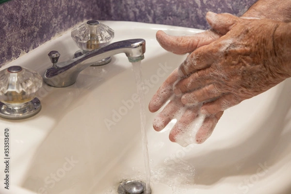 Fototapeta Soapy hands bathroom sink drain horizontal
