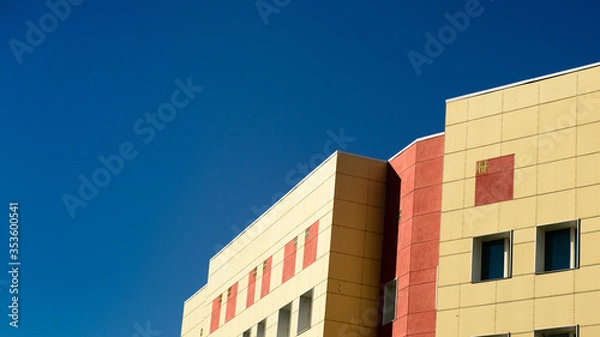 Fototapeta red and white building on the sky
