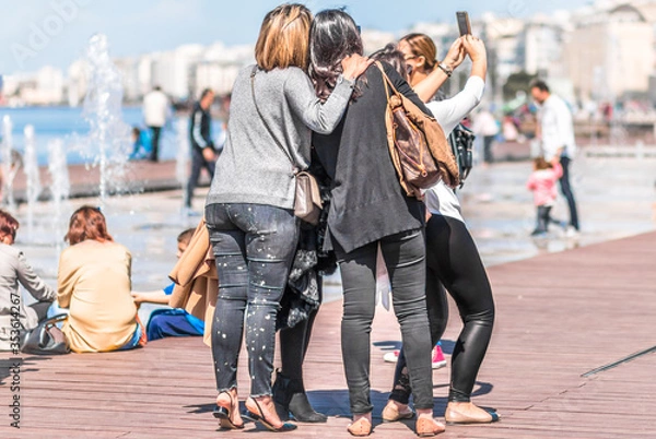 Fototapeta Group Of Friends Taking Selfie With Mobile Phone