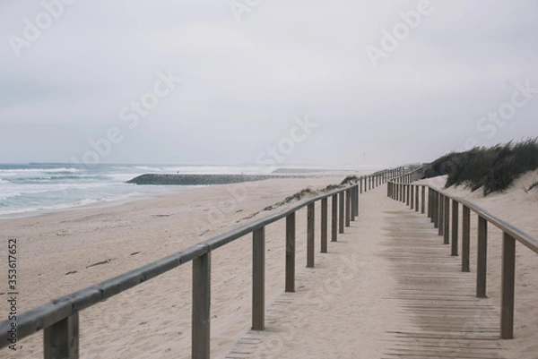 Fototapeta Beautiful empty moody shore of Atlantic ocean with turquoise waves and white sand