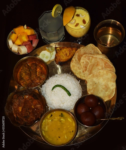 Fototapeta  Bengali thali for Jamai Sasthi Ritual. Jamayi Sosti ritual held every year in Bengali families which means Long life for Son In law. Top angle shot