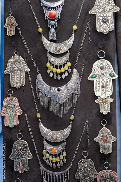 Obraz Silver hamsa souvenir sale on streets of kasbah - old part of city Chefchaouen, Morocco.