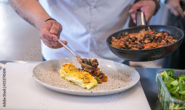 Fototapeta serving dishes on a plate in a professional kitchen close up