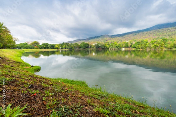 Fototapeta landscape lake views at Ang Kaew Chiang Mai University in nature forest Mountain views spring blue sky background with white cloud.
