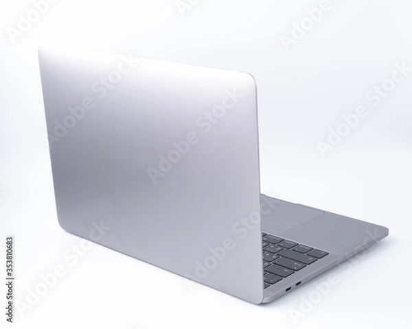 Fototapeta Soft focus of modern laptop with a blank screen, aluminum body material, isolated on white background. Clipping path
