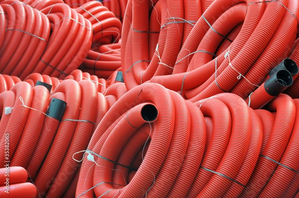 Obraz Stock red coiled plastic pipes