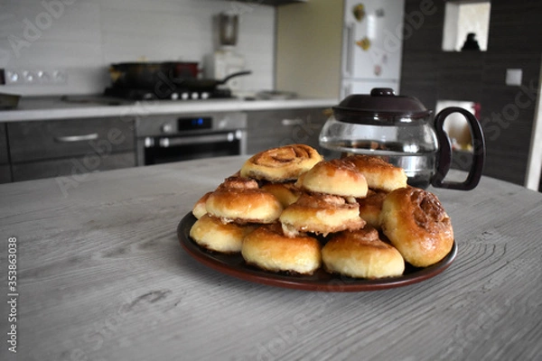 Obraz Cinnamon rolls with a teapot.