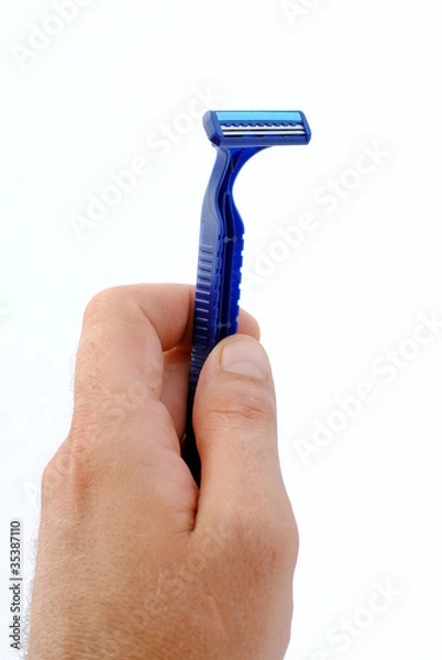 Fototapeta man hand holding a disposable blu razor