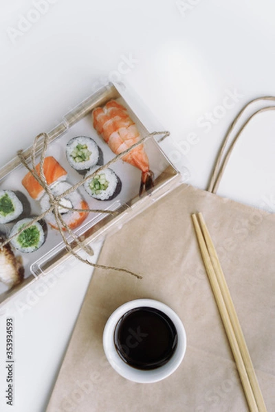 Obraz Sushi and rolls delivery service consept on white background (template, open space).