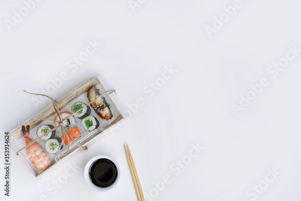 Obraz Sushi and rolls delivery service consept on white background (template, open space, top view).