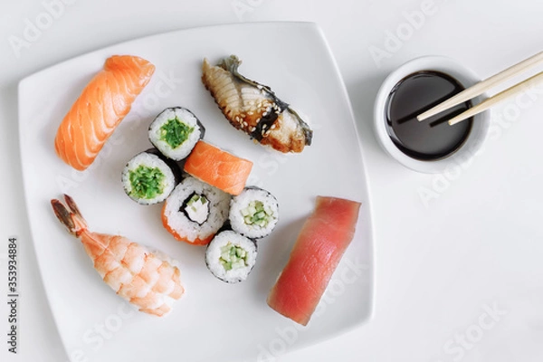 Obraz Mix of sushi and rolls close up on white background.