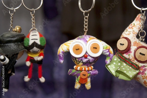 Fototapeta many dolls in key rings hanging in line