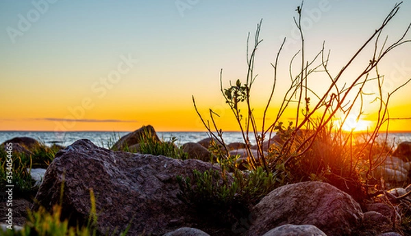 Obraz Sunset on the rocky beach.