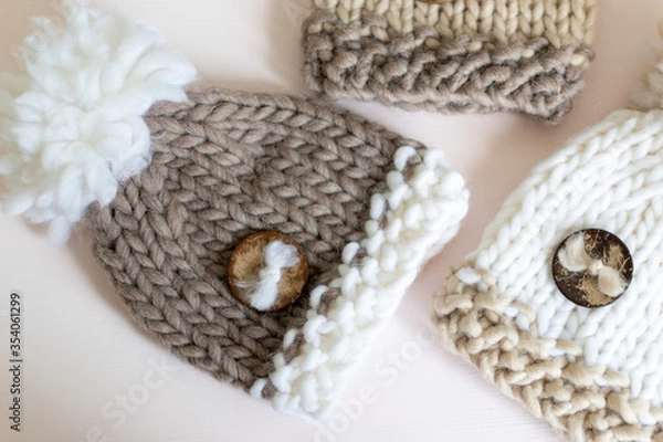 Obraz cute knitted beige pompom hats 