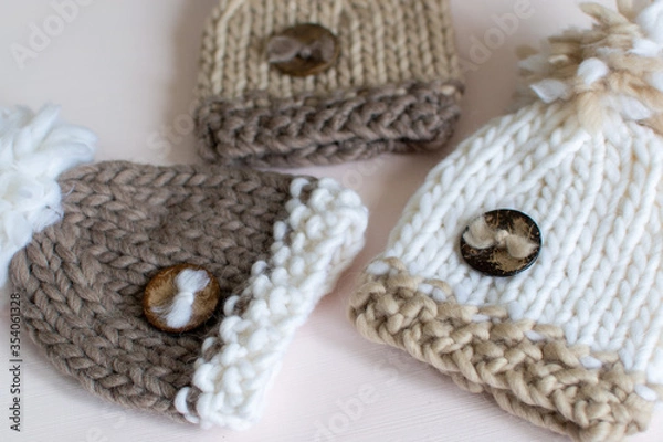 Obraz baby hats in brown and beige neutral colours 