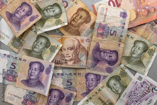 Fototapeta many different banknotes dollar euro yuan background