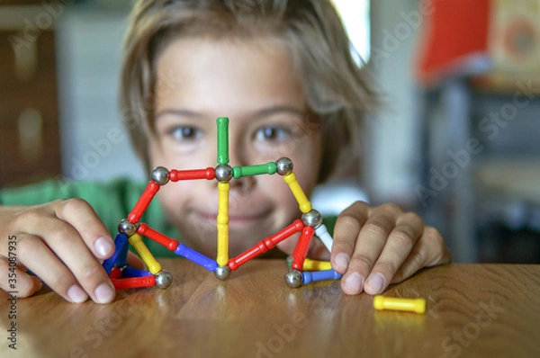 Obraz Playing with magnet constructor at home