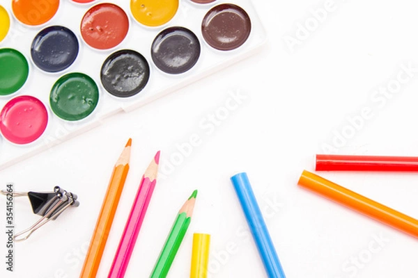 Obraz Children's Preschool Art Supplies.pencils, scissors, paints isolated on white background.Great set for kids in camp, school and kindergarten.drawing set
