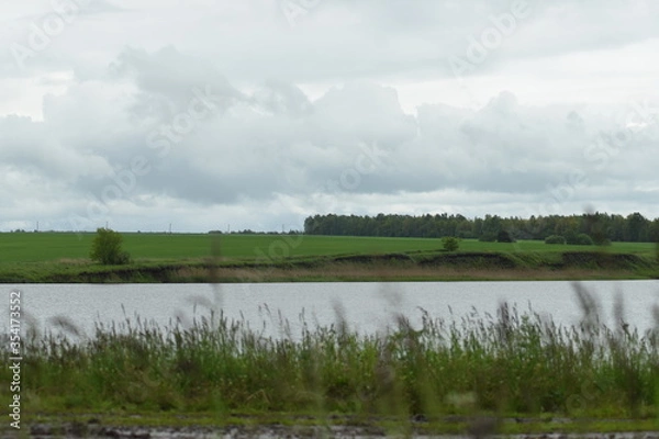 Fototapeta landscape with river and clouds