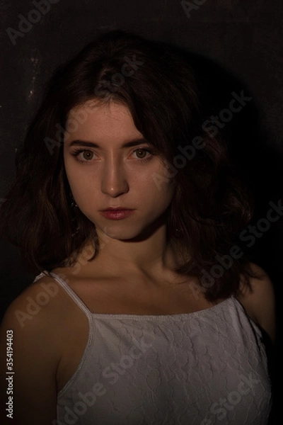 Fototapeta Female studio portrait in low light conditions