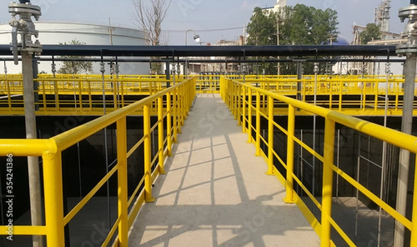 Obraz Walk way with yellow handrail inside factory