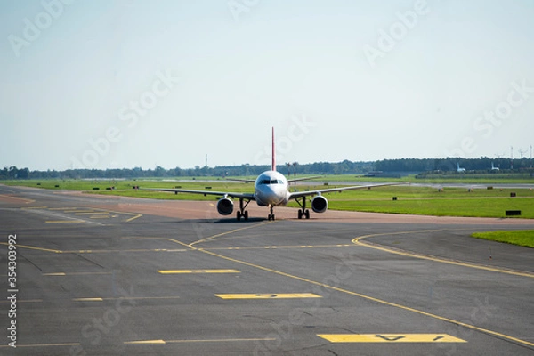 Fototapeta Plane on the runway front view
