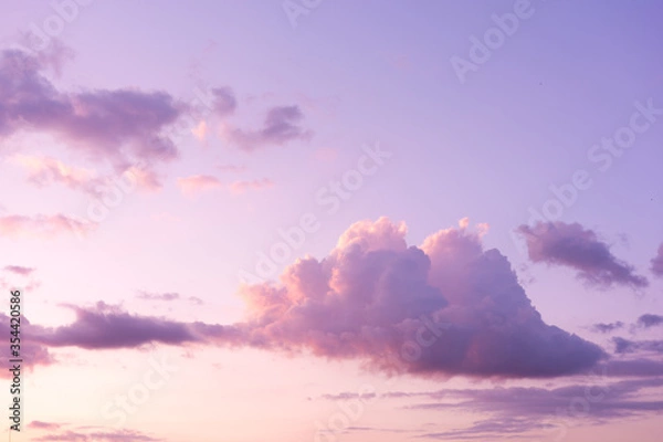 Fototapeta Soft purple clouds on sunset sky background. Pastel colored cloudscape. Pink clouds background