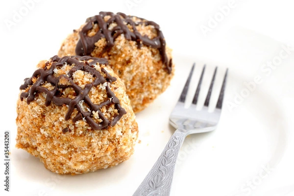 Fototapeta Mini cakes on white background