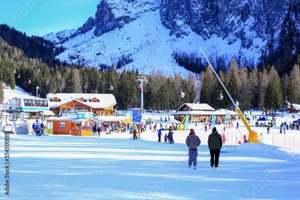 Fototapeta Alleghe, Italy, 01/20/2020 , Ski area at Piani di Pezzè, 1470 meters above sea level, gives immediate access to the ski Civetta area and is the ideal starting point to explore the Civetta massif.
