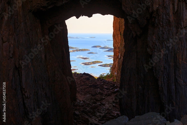 Fototapeta View through a hole in the mountain in Norway, Torghatten