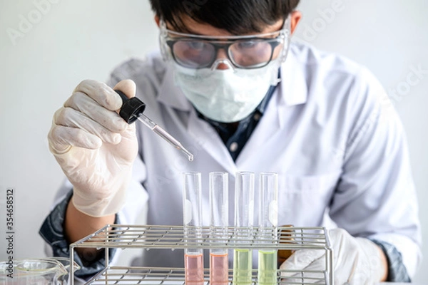 Fototapeta Biochemistry laboratory research, Chemist is analyzing sample in laboratory with equipment and science experiments glassware containing chemical liquid