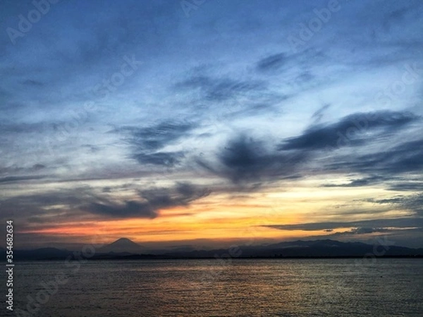 Fototapeta sunset over the sea with Mount Fuji view.