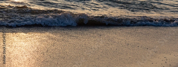 Obraz Gentle surf closeup on the Baltic Sea in the sunset