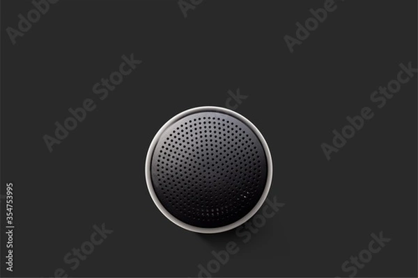 Fototapeta Black Wireless Bluetooth Speaker Isolated on Plain Black Background, Viewed From Above; Top View of Music Player Showing Perforated Metal Grille Holes.
