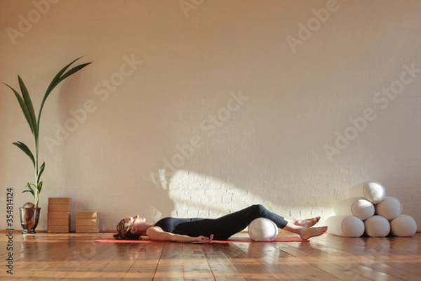 Obraz Woman doing breathing exercise in shavasana