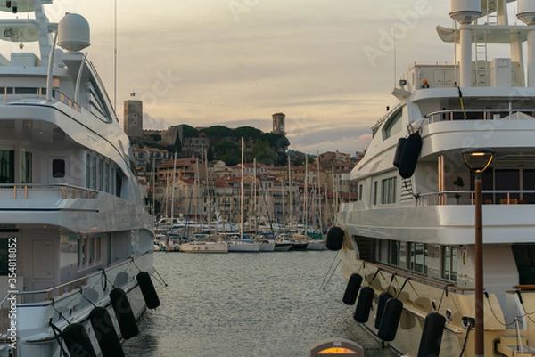 Obraz Luxury yachts harbor at golden hour view at Cannes Yacht Charter.
Cannes is one of the most famous resorts on the French Riviera and is home to a huge number of superyachts with its’ two large ports.