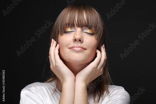 Fototapeta Portrait of a beautiful female on black background