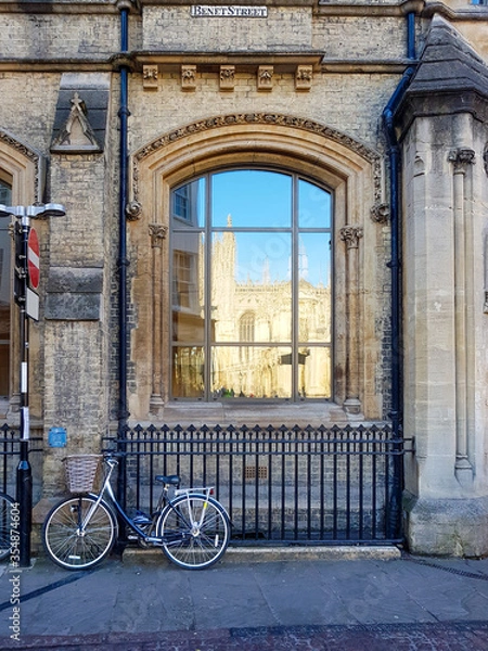 Obraz Bicycle against railing on Benet Street in Cambridge, United Kingdom