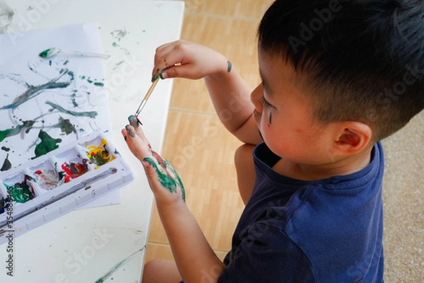 Obraz Funny little boy with painted hand