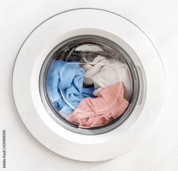 Obraz Working washing machine on white background
