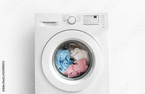 Obraz Working washing machine on white background