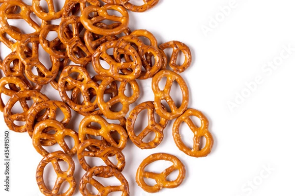 Fototapeta Salt pretzels isolated on white background. Salty snacks. Top view. Closeup.