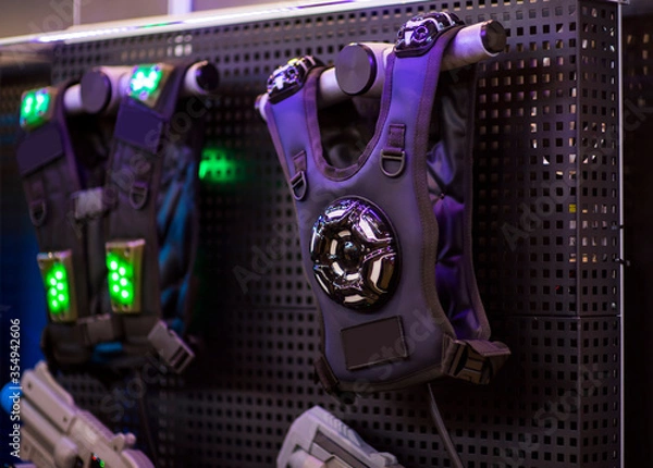 Fototapeta laser tag gun and armor. A variety of weapons for playing laser tag. close up on military equipment on laser tag game