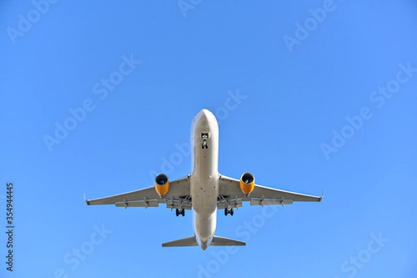 Fototapeta Passenger plane on landing approach